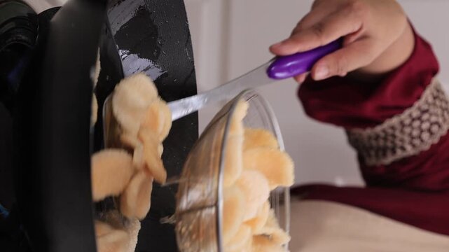 Process Deep Frying Crackers in the Hot Oil, Kitchen Step by Step. Goreng Kerupuk, Indonesian Crackers