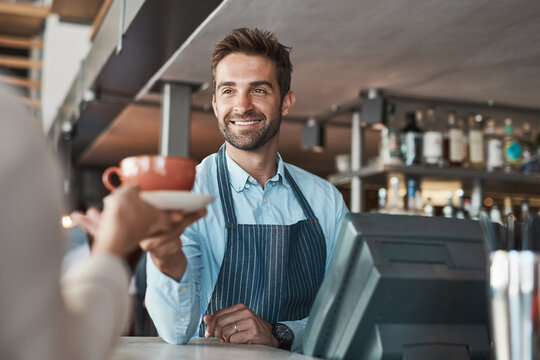 Smile, man and waiter with coffee in cafe for customer service, giving order and food hospitality of store. Happy, male server and counter with drink process, breakfast industry and espresso services