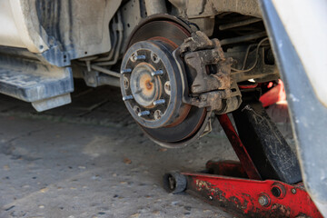 Mechanic changing a wheel of a modern car