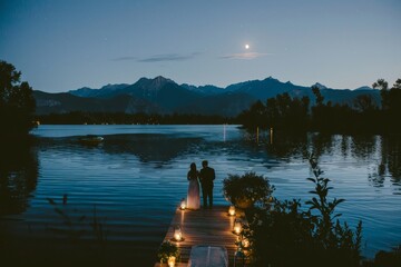 Obraz premium Serene Moonlit Lakeside Wedding with Romantic Floral Arrangements.