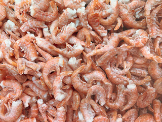 Frozen shrimps prawns. Raw shrimp background. Pile of frozen shrimps background.
