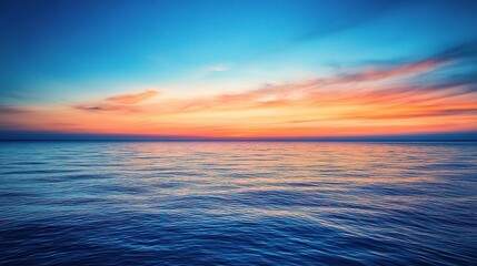Obraz premium Serene Sunset over Tranquil Sea: A breathtaking view of a fiery sunset over the vast, tranquil ocean, creating a mesmerizing interplay of colors and emotions.