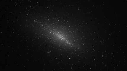 Fototapeta premium A monochrome image of a distant galaxy filled with stars, showcasing cosmic beauty.