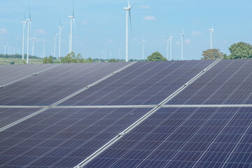 Solar panel and wind generator on a background of blue sky. Green energy