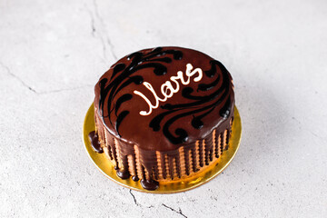 Delicious homemade layered chocolate cake with chocolate chips.