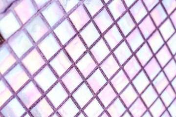 Texture of mother-of-pearl mosaic tiles, close-up