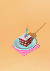 Piece of cake on a blue plate, blue fork and pink napkin. Minimal party scene on yellow background.