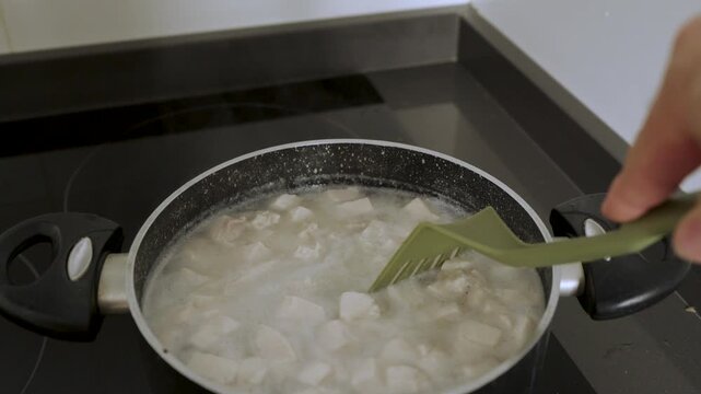 4k Video at 25 fps of a Pot Boiling a Traditional Stew with Rice and Meat