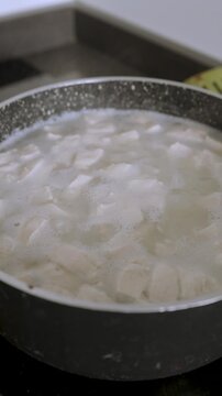 4k Video at 25 fps of a Pot Boiling a Traditional Stew with Rice and Meat