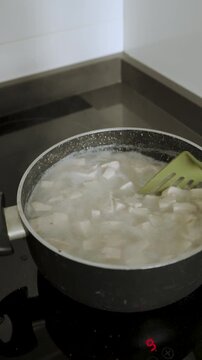 4k Video at 25 fps of a Pot Boiling a Traditional Stew with Rice and Meat