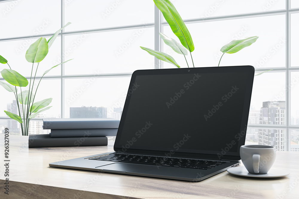 Poster Modern laptop on desk with cup of coffee in bright office with large windows. 3D Rendering