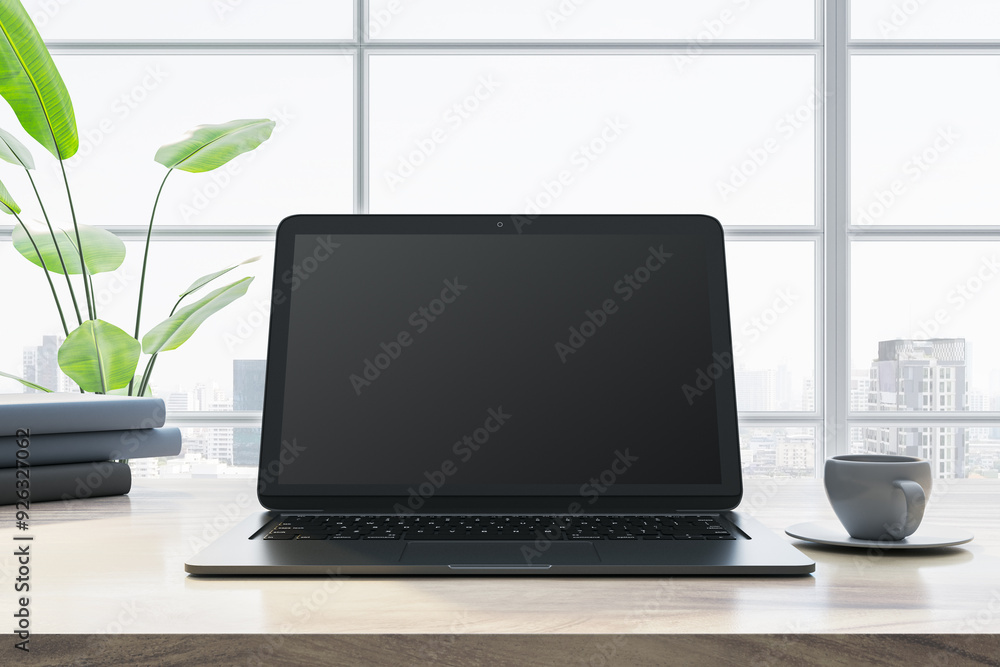 Aufkleber modern laptop on a desk in front of large windows with a city view. 3d rendering