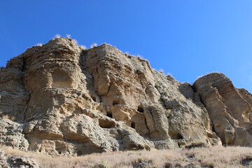 Caves in the Risco de las Cuevas, Perales de Taju&ntilde;a, Spain, ancient dwellings and storage spaces from the Roman and Medieval periods carved into the earth