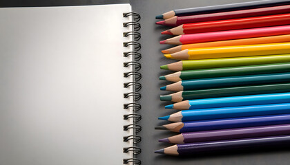 Fototapeta premium set of colored pencils for art class and a sketchbook