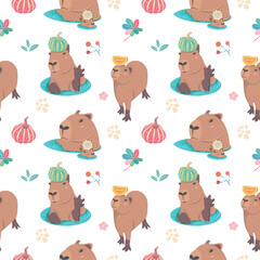 Fototapeta premium Cute seamless pattern with capybara, floral and pumpkin. Perfect for kids apparel, greeting card design, fabric print, baby shower, wallpaper, wrapping paper design, baby prints and home textiles. 