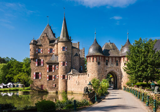 Mechernich, Germany: The Satzvey Burg Water Castle with Blue Sky in North-Rhine Westphalia