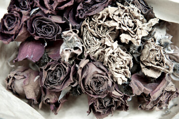 Close up of die roses on dried flower market for decoration. Bouquet. Past valentine day. Sad and lonely. Vintage Filter. Top view.