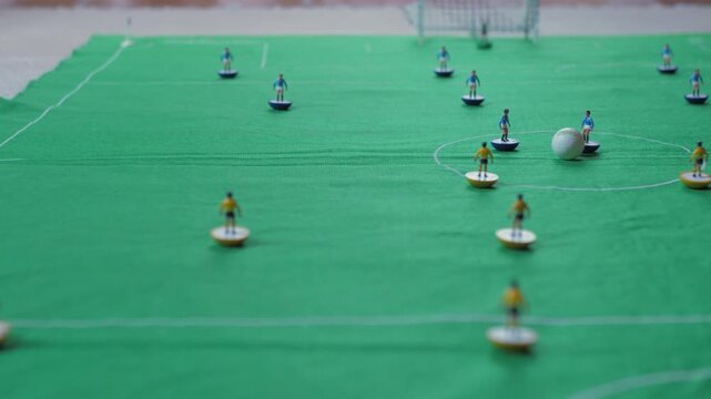 playing  classic table football game 4k