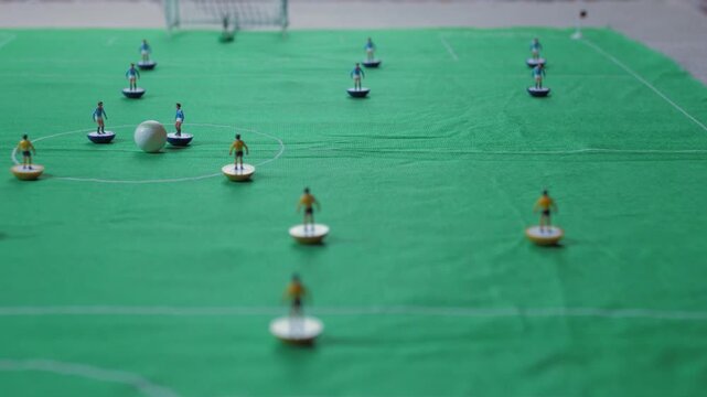 playing  classic table football game 4k