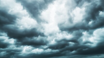 Fototapeta premium Gathering of dark storm clouds before a powerful thunderstorm, creating a dramatic and ominous atmosphere in the natural sky.