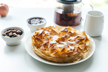 Sweet pie, homemade pastries on a light background. Selected focus. Close-up. High quality photo