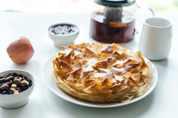 Sweet pie, homemade pastries on a light background. Selected focus. Close-up. High quality photo