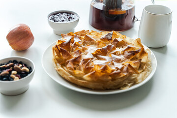 Sweet pie, homemade pastries on a light background. Selected focus. Close-up. High quality photo
