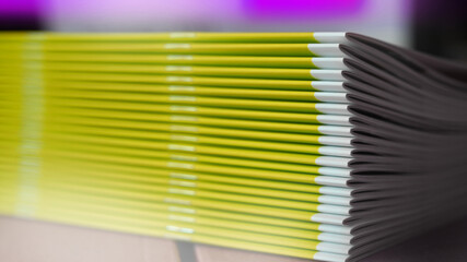 Stitched stapling printing brochures report in the bookbindery or print shop. Print paper sorted...