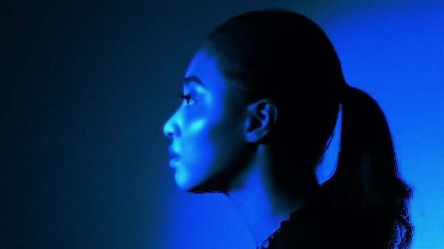 A woman's face expressed with a digital dot pattern