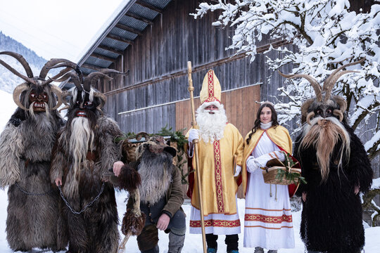 Traditional Austrian Krampus and Saint Nicholas Characters in Winter