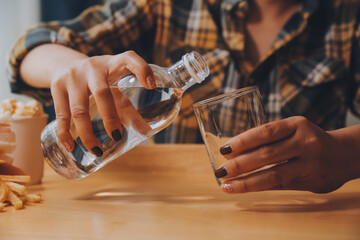 healthy beautiful young woman holding glass of water