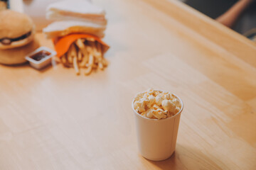 A woman holding a bowl of popcorn
