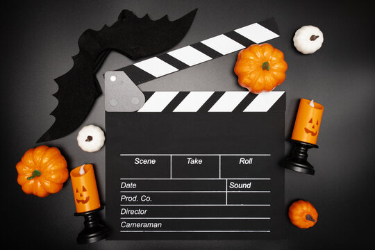 October celebration, horror Halloween movie set, cinematic clapper board and spooky decorations.