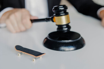 No skateboarding sign on the street. Skateboarding prohibition symbol in city. No skateboarding sign.