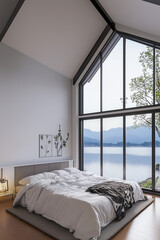 Fototapeta premium Luxury minimalist bed room, two floor high ceiling. Garden, courtyard view outside the window. Spacious cozy bed. 