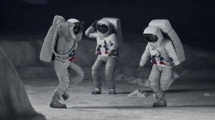 Three astronauts dance happily on the moon