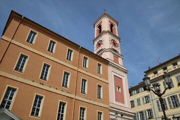 Palais Rusca Palace and Tour de l'Horloge clock tower at Place du Palais de Justice Palace square in historic Vieux Vieille Ville old town of Nice, France.