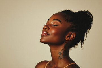 A close up of a tattooed black woman's face with her eyes closed