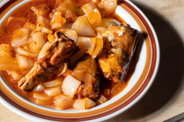 Ginisang sardinas - sauteed sardines in tomato sauce with onions and garlic in the Philippines