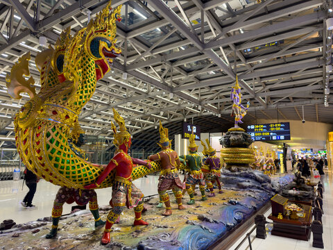 Saturday 17 August 2024 Thai mythical soldiers holding a mythical snake called payanak in BKK Bangkok Airport 