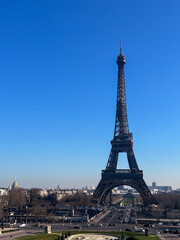 Fototapeta premium View of the Eiffel Tower in Paris France with blue sky