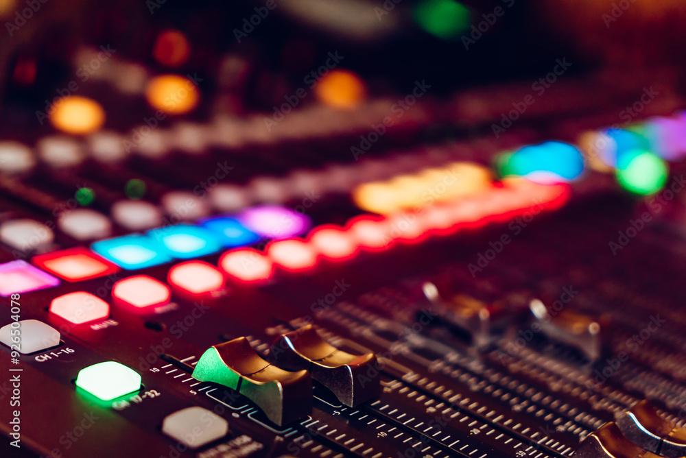 Wall mural close-up of a sound mixing console with colorful buttons and knobs. a detailed view of a sound mixin