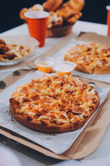Group of young friends eating pizza.Home party.