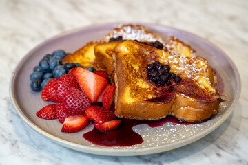 French toast with strawberry, blueberry and blackberry.