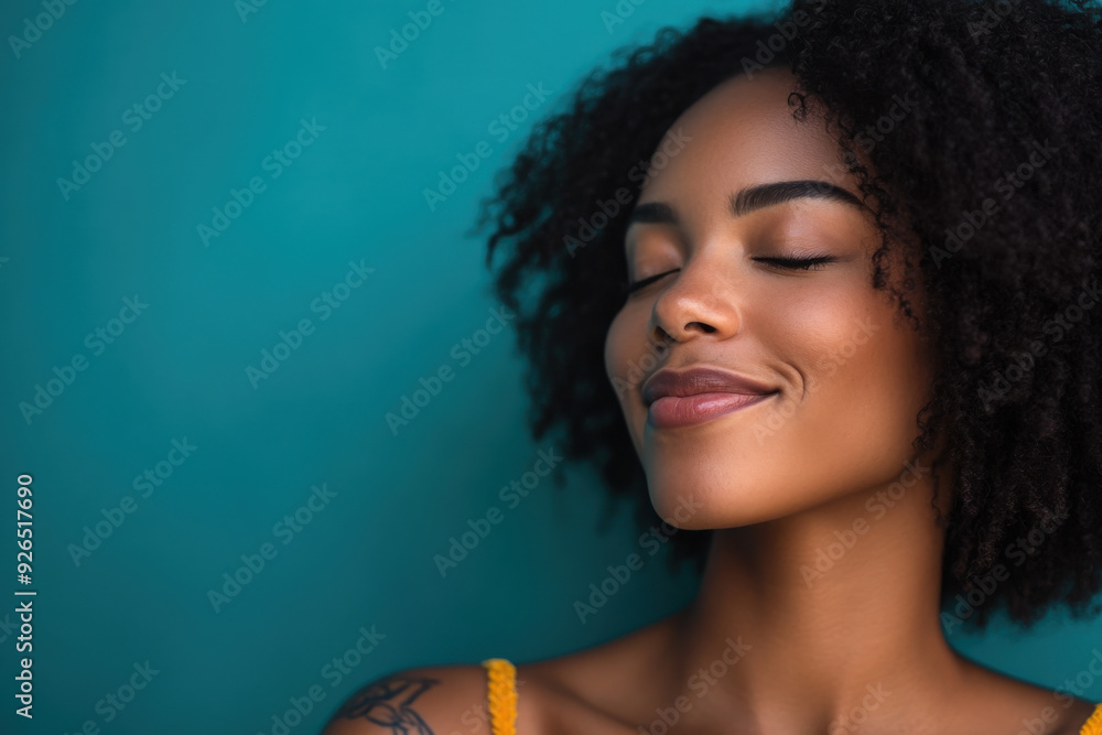 Wall mural a close up of a tattooed black woman's face with her eyes closed