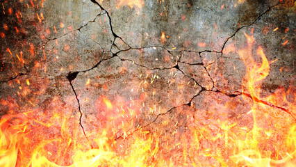 Flame of fire with sparks near grey d concrete damaged cracked wall. Explosion and fire background,...