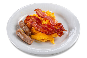 Scrambled eggs, bacon and sausage breakfast in white plate isolated