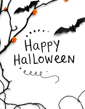"Happy Halloween" text written on white background, bats, pumpkins