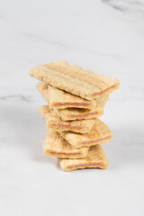 Crispy Corn oat rice bars strips with fruit and berry filling. In the section. Close-up