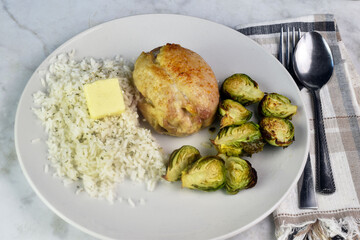 chicken thighs  with rice and brussel sprouts